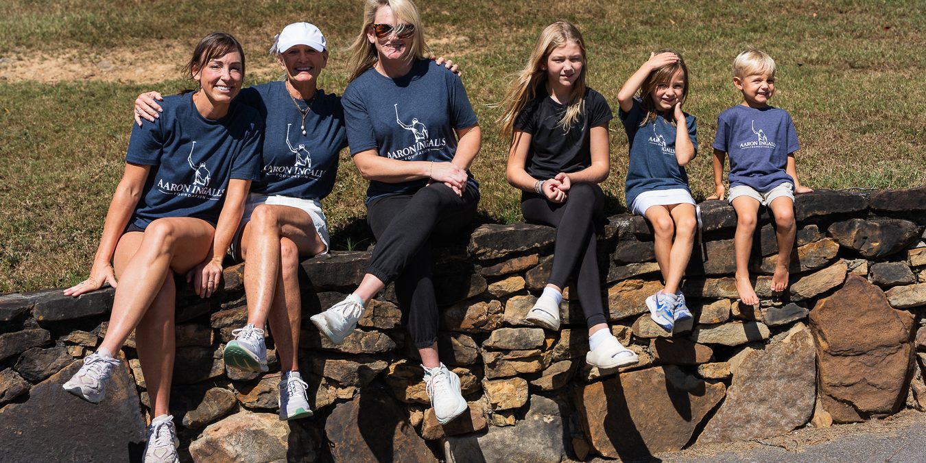Supporters wearing navy Aaron Ingalls Foundation T-shirts